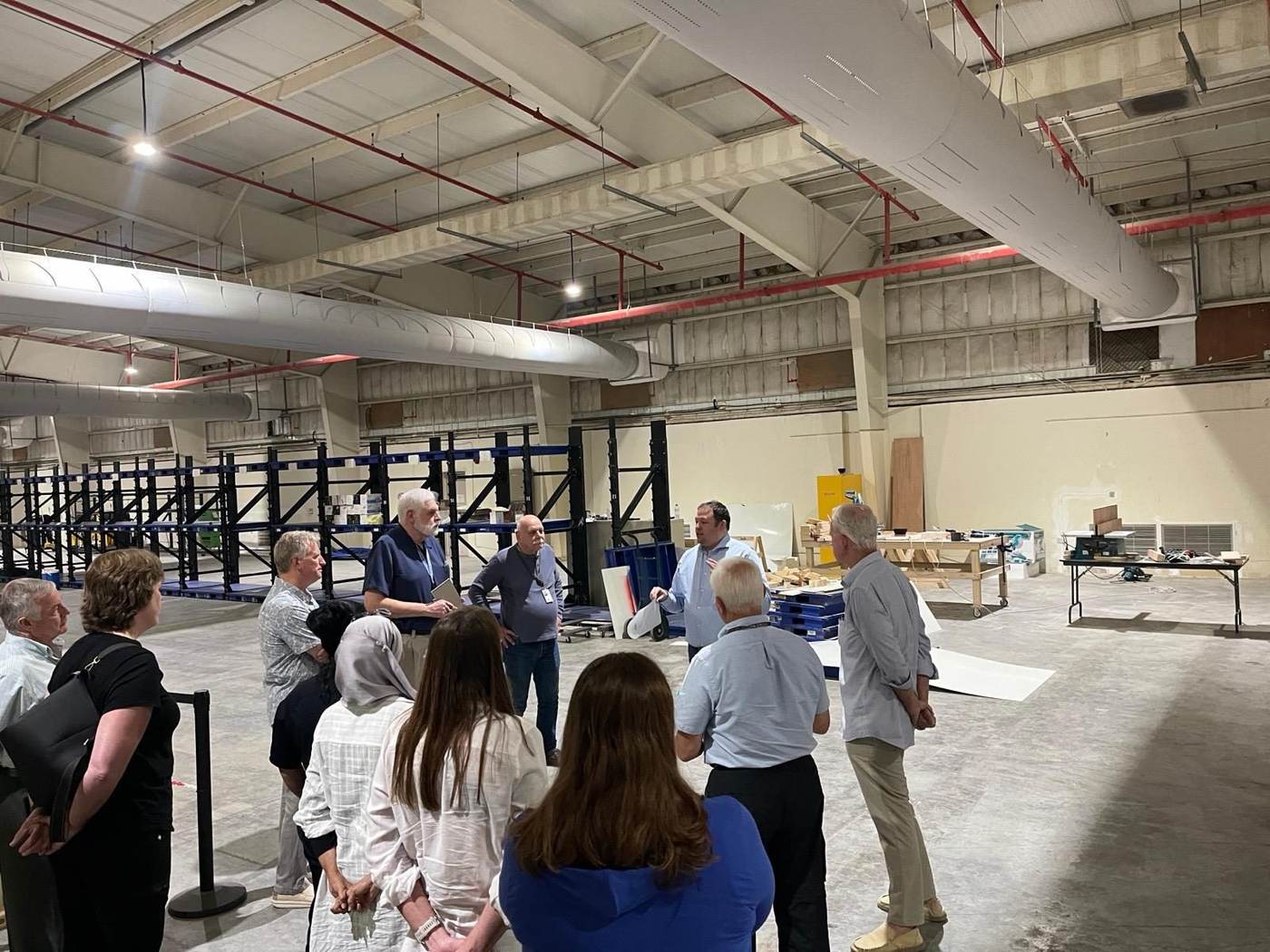 Group reviewing a warehouse site during a walkthrough